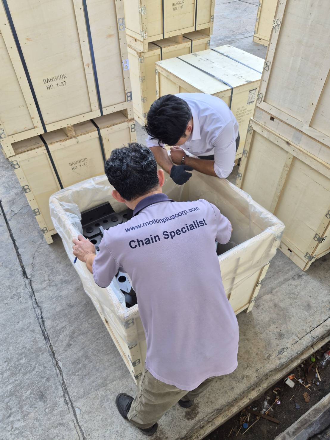 MPC Chain Specialist conducting incoming inspection of MPC-HS forged chain parts from opened crate